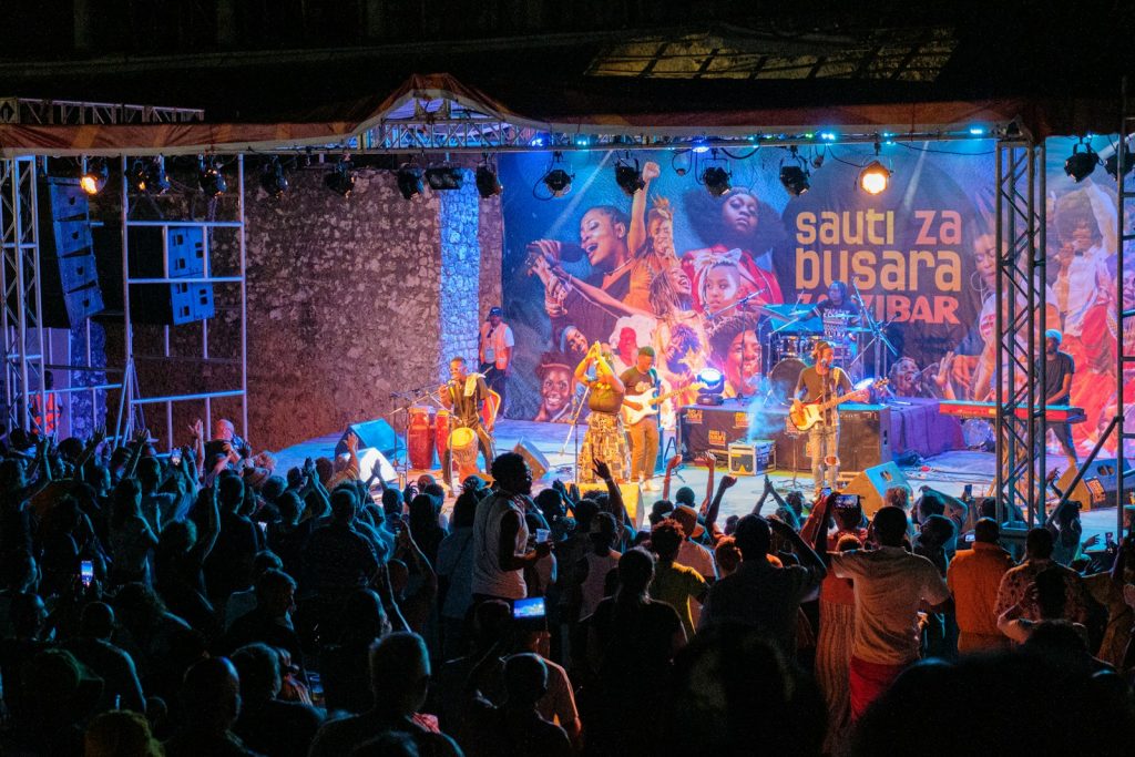 a group of people standing on top of a stage